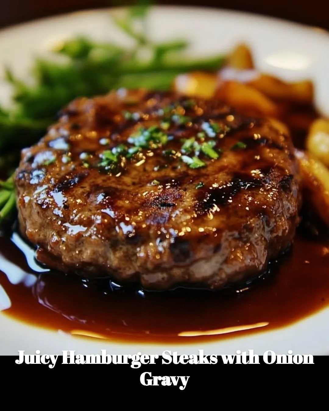 Juicy hamburger steaks served with flavorful onion gravy on a plate.