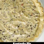 Slice of Kentucky Pie served on a rustic plate with fresh whipped cream