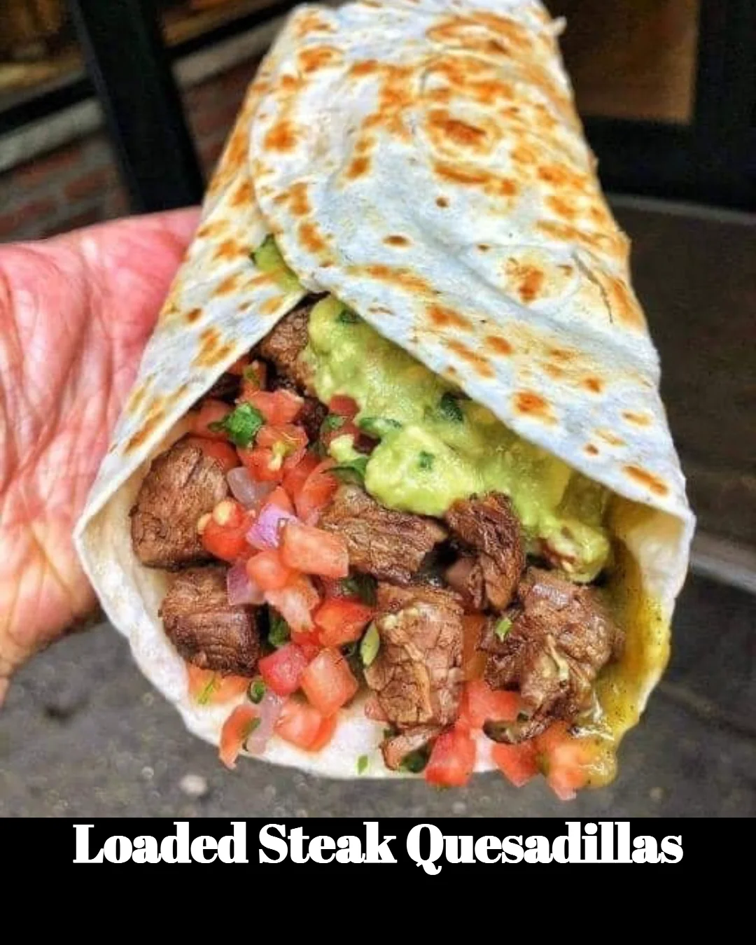 Delicious loaded steak quesadillas with cheese and toppings.