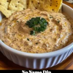 A bowl of No Name Dip served with fresh vegetables and chips.