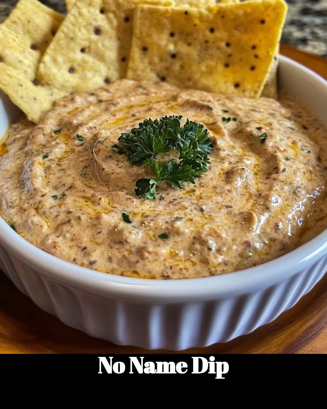A bowl of No Name Dip served with fresh vegetables and chips.