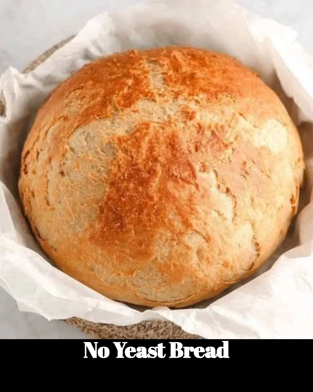 Slice of freshly baked no yeast bread on a wooden cutting board