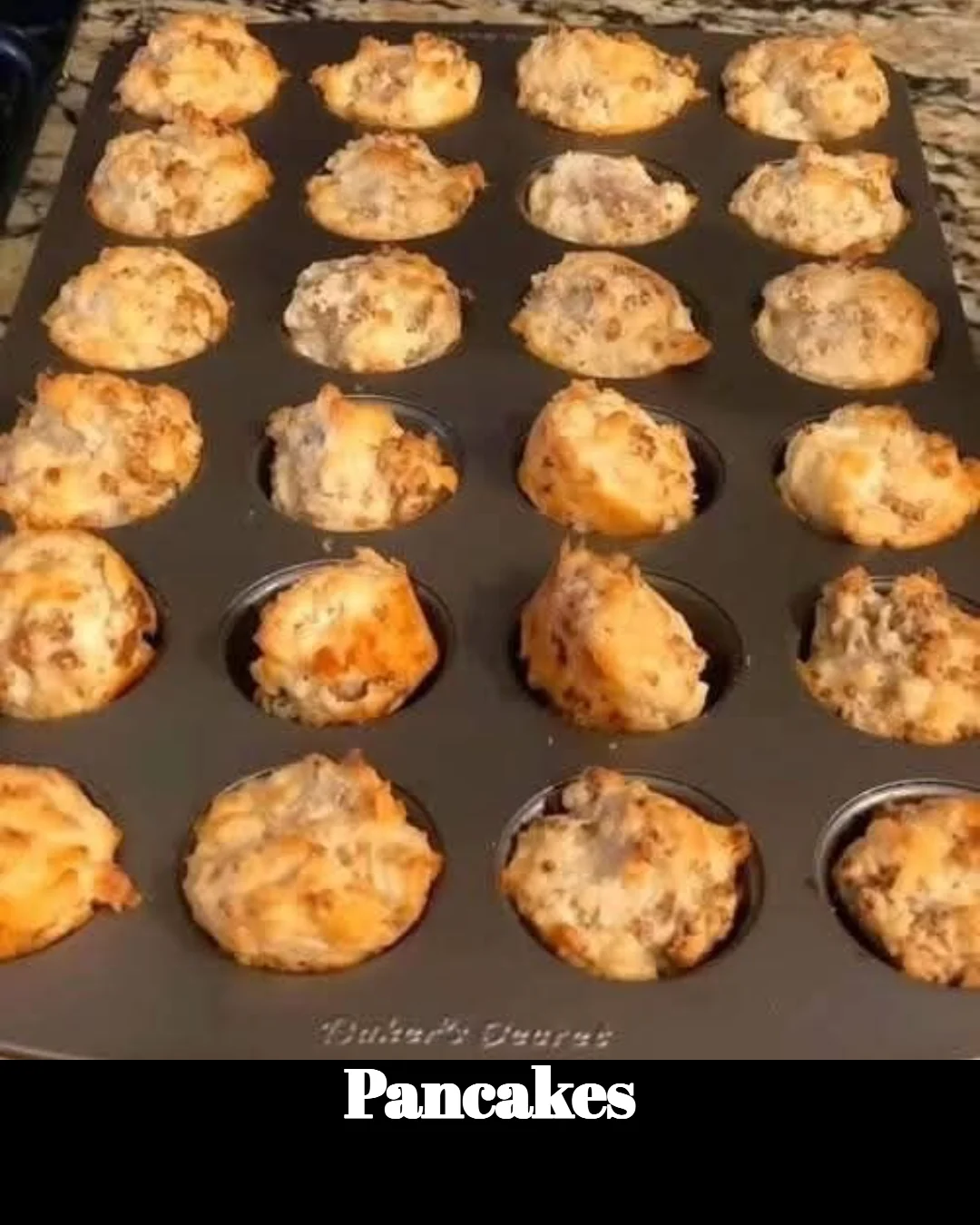 Stack of fluffy pancakes drizzled with syrup and topped with fresh berries