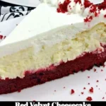 Slice of Red Velvet Cheesecake topped with cream cheese frosting on a plate