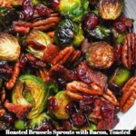 Dish of roasted Brussels sprouts with bacon, pecans, cranberries, and balsamic glaze
