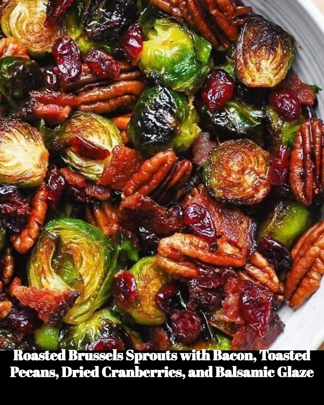 Dish of roasted Brussels sprouts with bacon, pecans, cranberries, and balsamic glaze