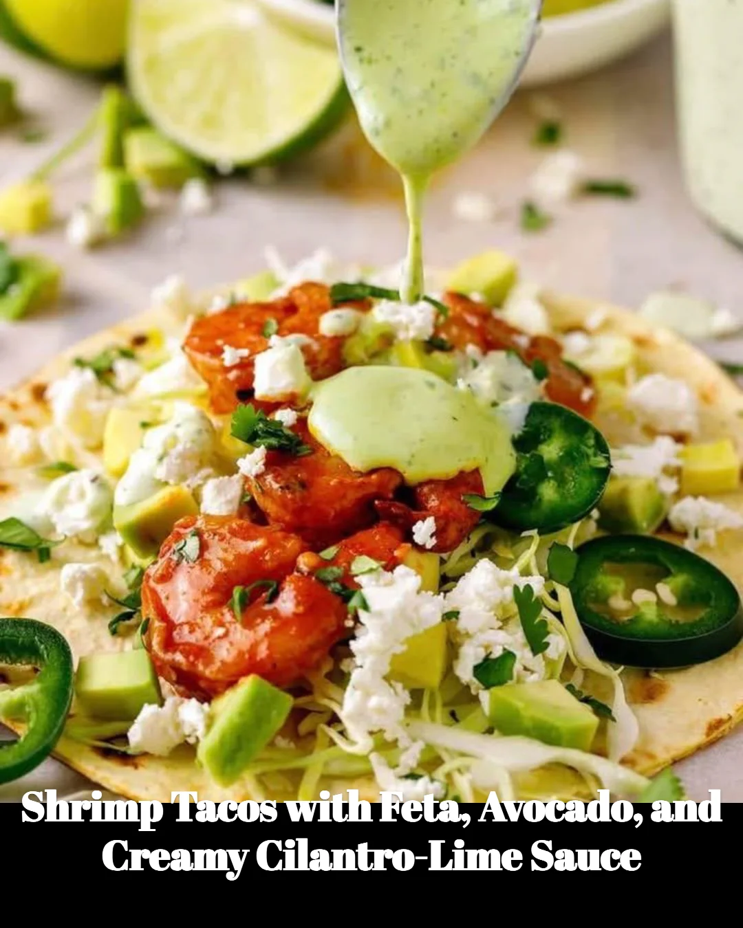 Shrimp tacos topped with feta, avocado, and creamy cilantro-lime sauce