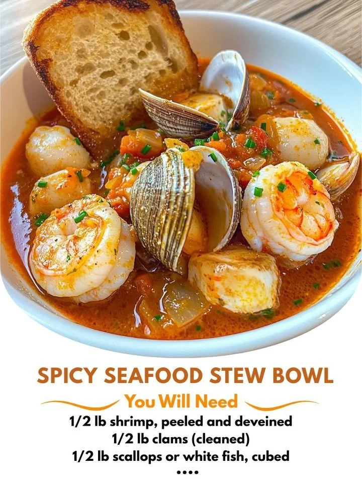 Bowl of spicy seafood stew with toasted bread on the side