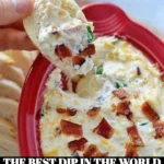 Delicious bowl of the best dip in the world served with fresh vegetables and chips.