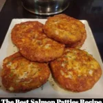 Delicious homemade salmon patties ready to serve with a fresh garnish