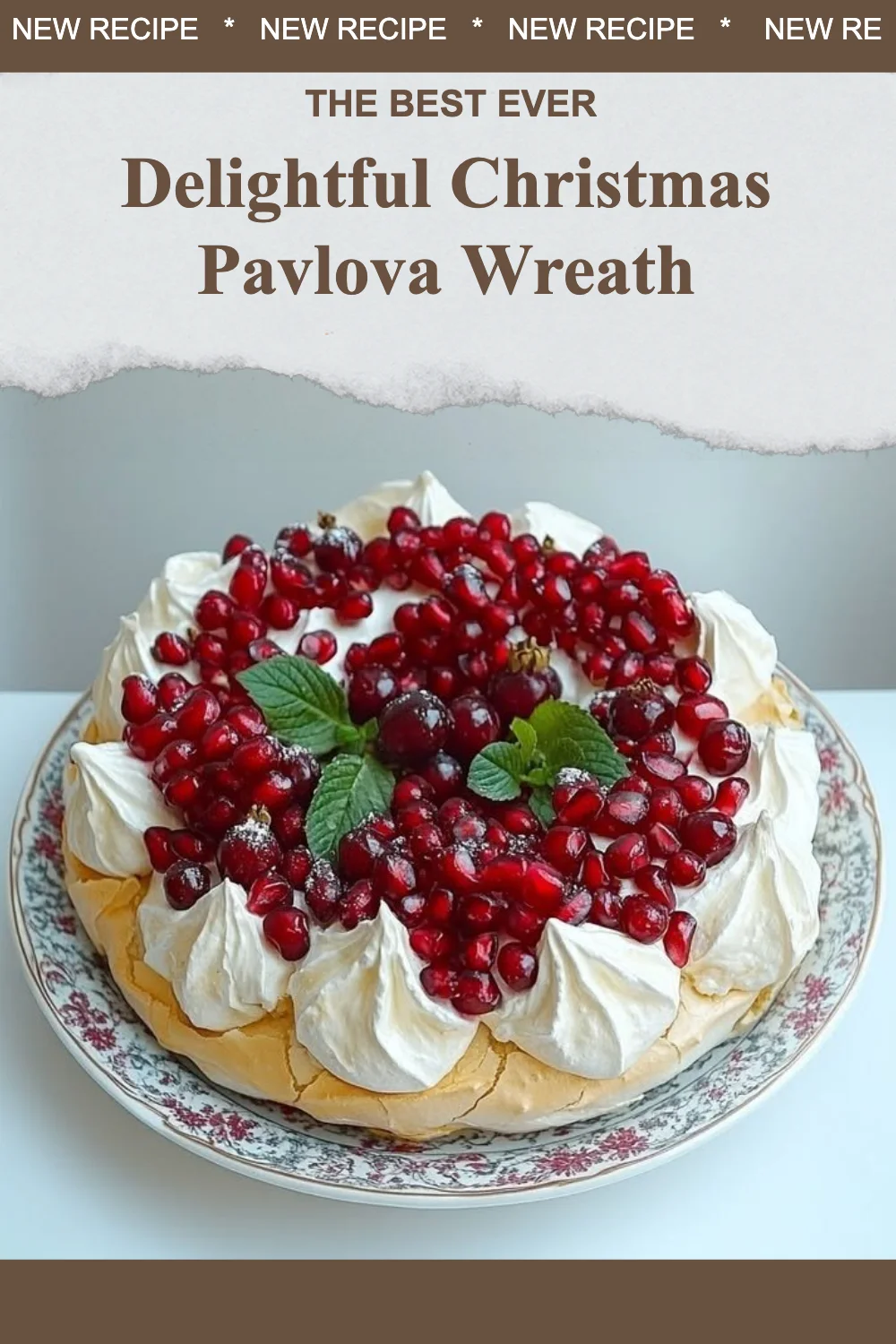 A festive Christmas pavlova wreath topped with fresh berries and mint leaves.