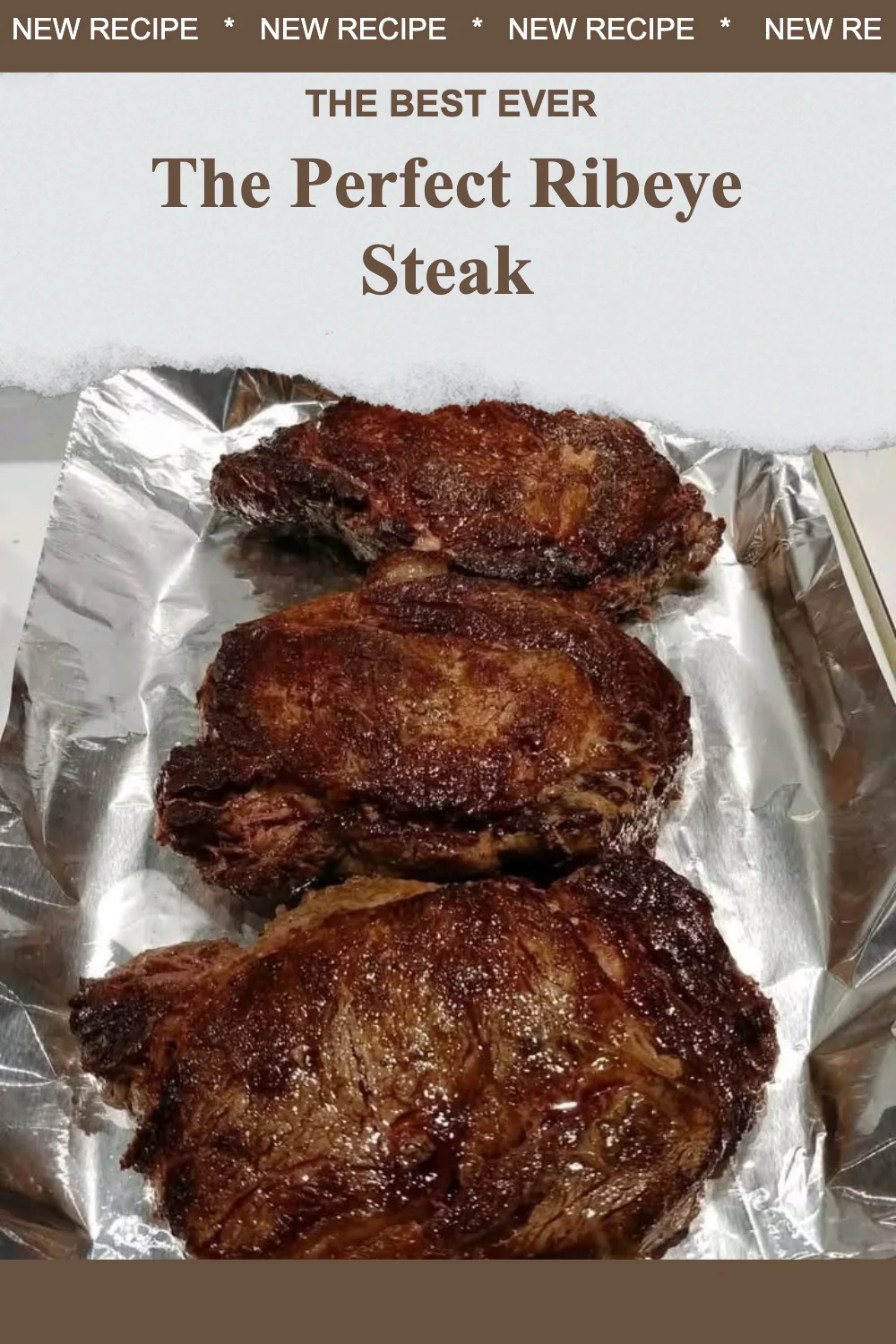 Cooked ribeye steak served on a plate with herbs and spices.